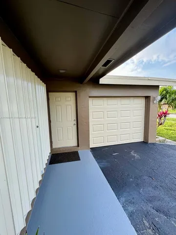 a view of empty room with garage and window