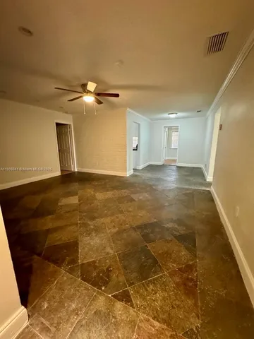 a view of a livingroom with a ceiling fan