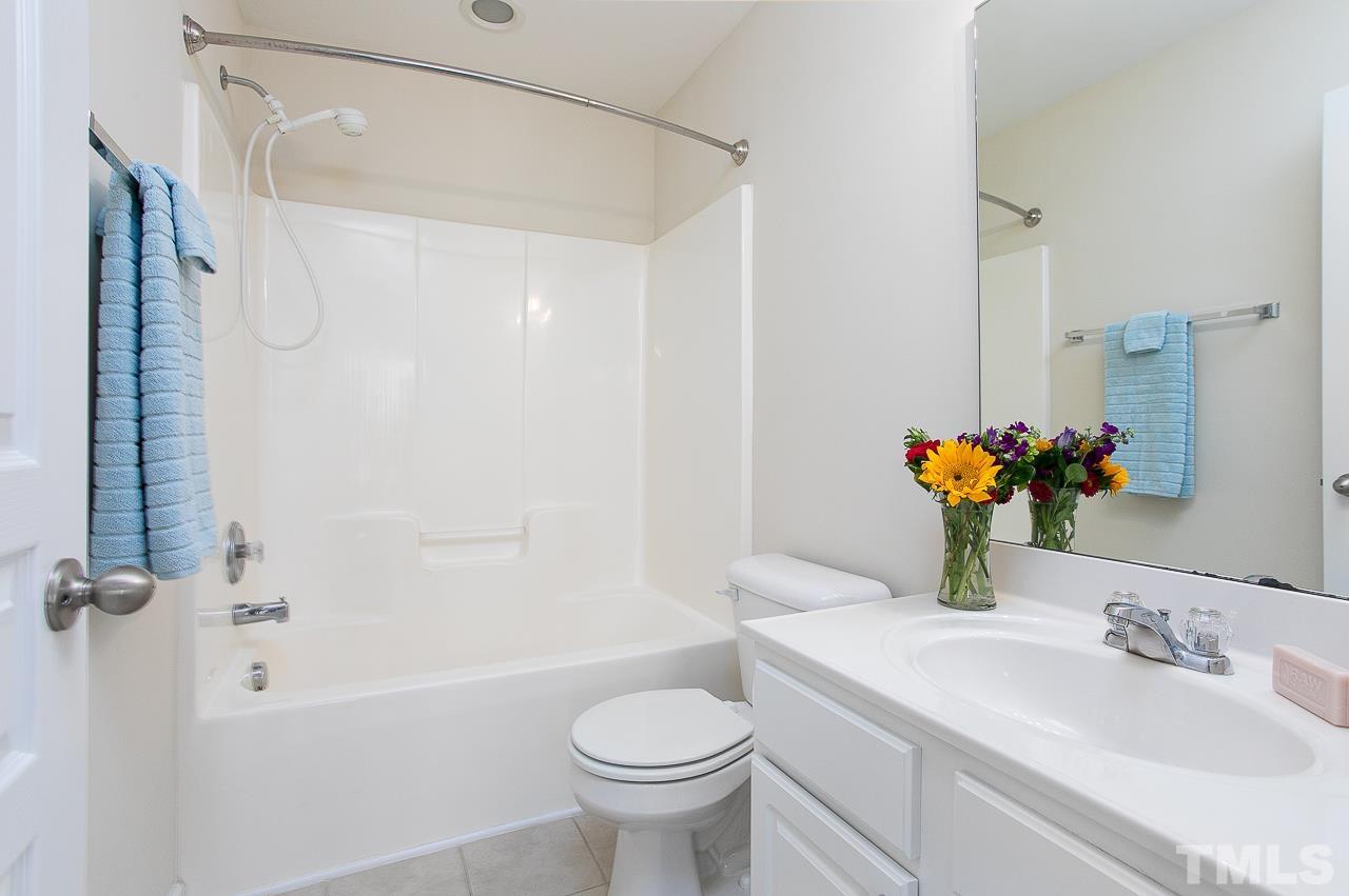 6016 Viking Drive Raleigh, NC 27612 - Photo 15 of 18 a bathroom with a sink toilet and shower