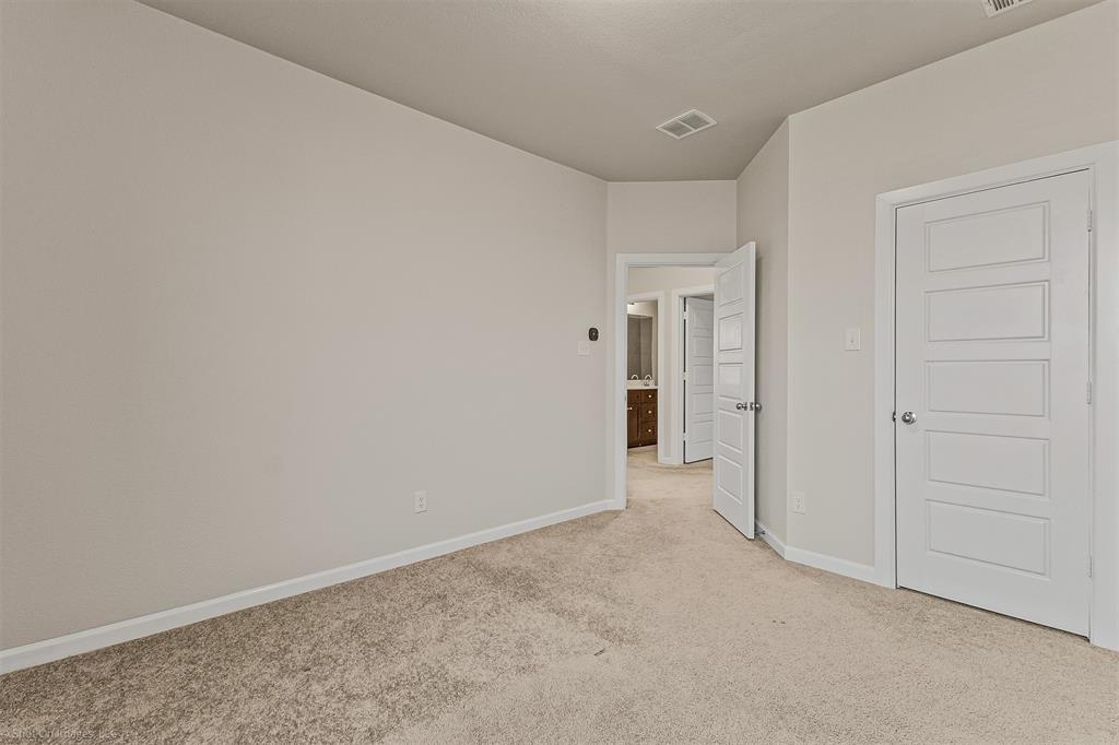638 Pinehurst Road Red Oak, TX 75154 - Photo 13 of 38 Unfurnished bedroom featuring baseboards and light carpet
