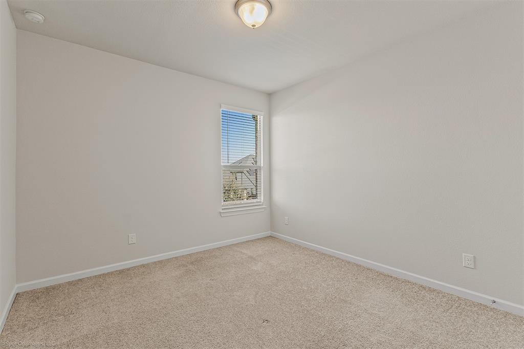 638 Pinehurst Road Red Oak, TX 75154 - Photo 15 of 38 Carpeted empty room featuring baseboards