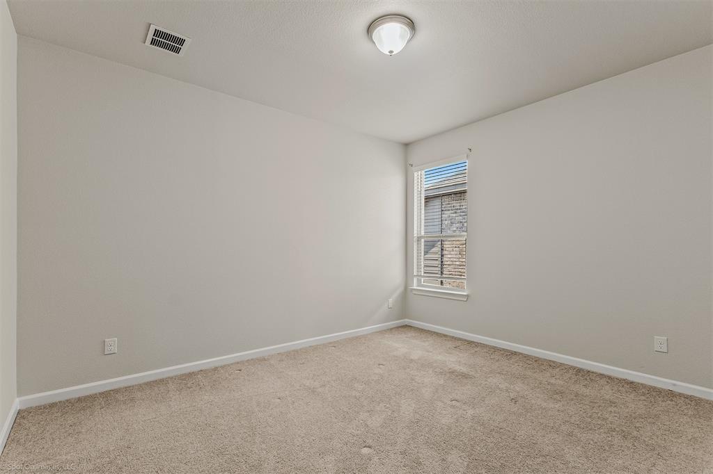 638 Pinehurst Road Red Oak, TX 75154 - Photo 21 of 38 Spare room featuring baseboards and carpet floors