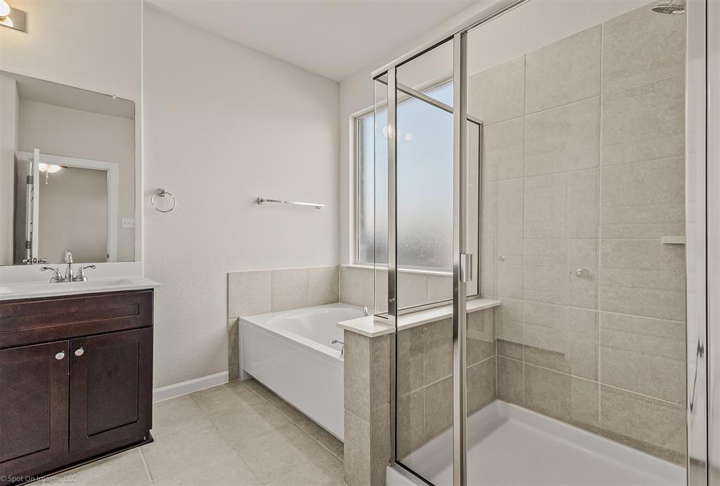 638 Pinehurst Road Red Oak, TX 75154 - Photo 22 of 38 Full bath featuring vanity, a garden tub, a stall shower, and light tile patterned floors