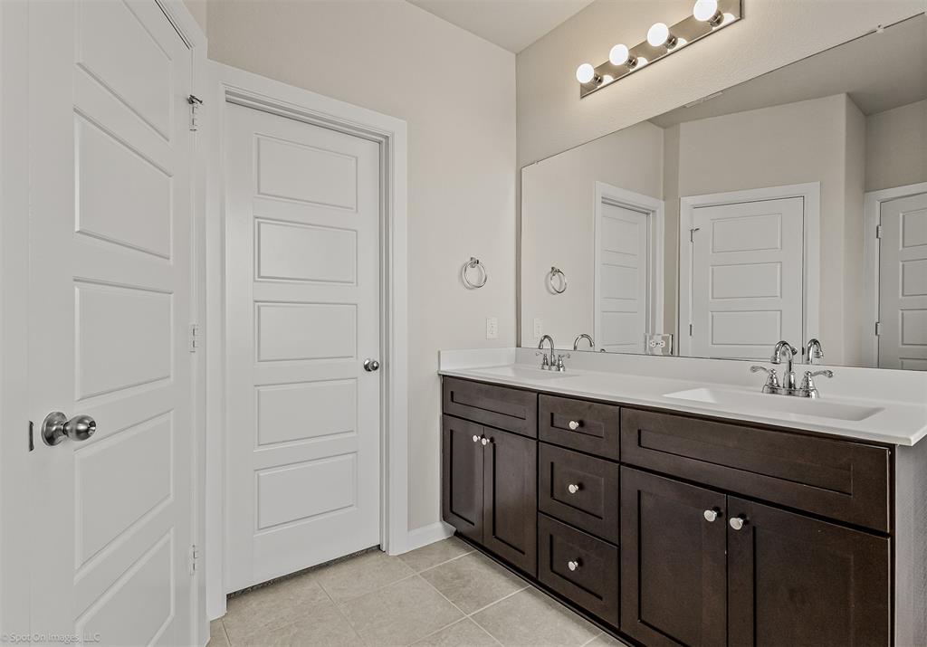 638 Pinehurst Road Red Oak, TX 75154 - Photo 23 of 38 Bathroom featuring double vanity and light tile patterned floors
