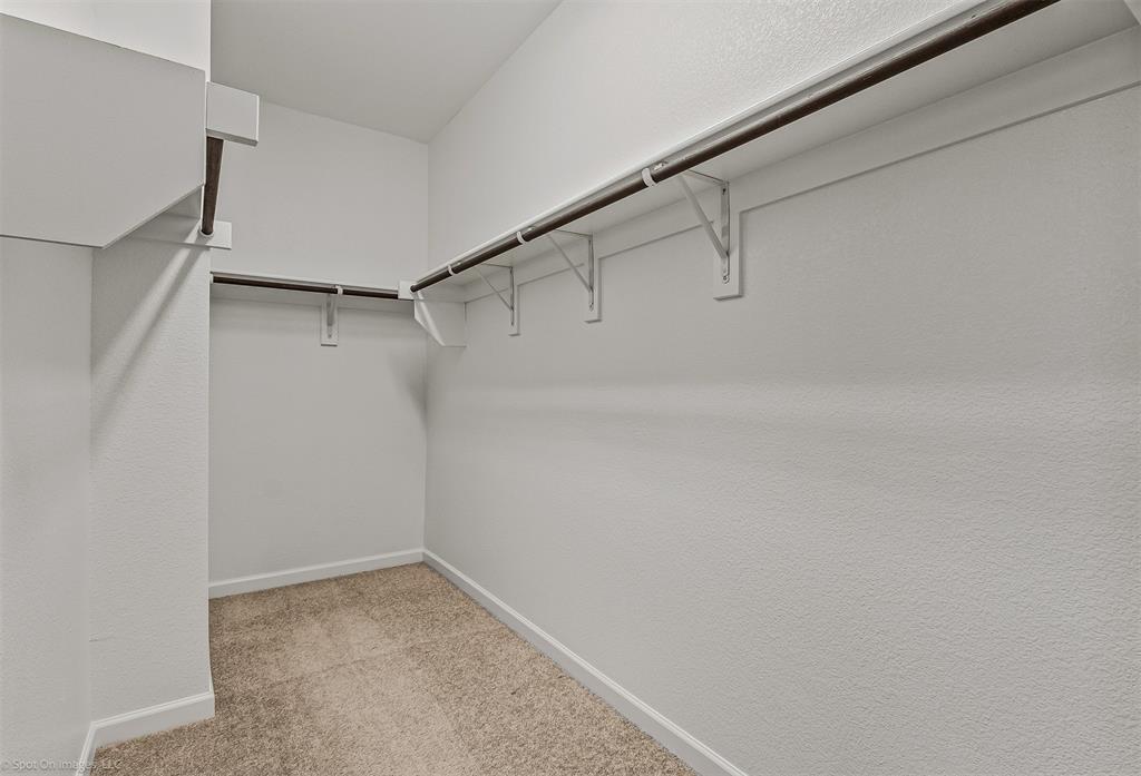 638 Pinehurst Road Red Oak, TX 75154 - Photo 24 of 38 Walk in closet with light colored carpet