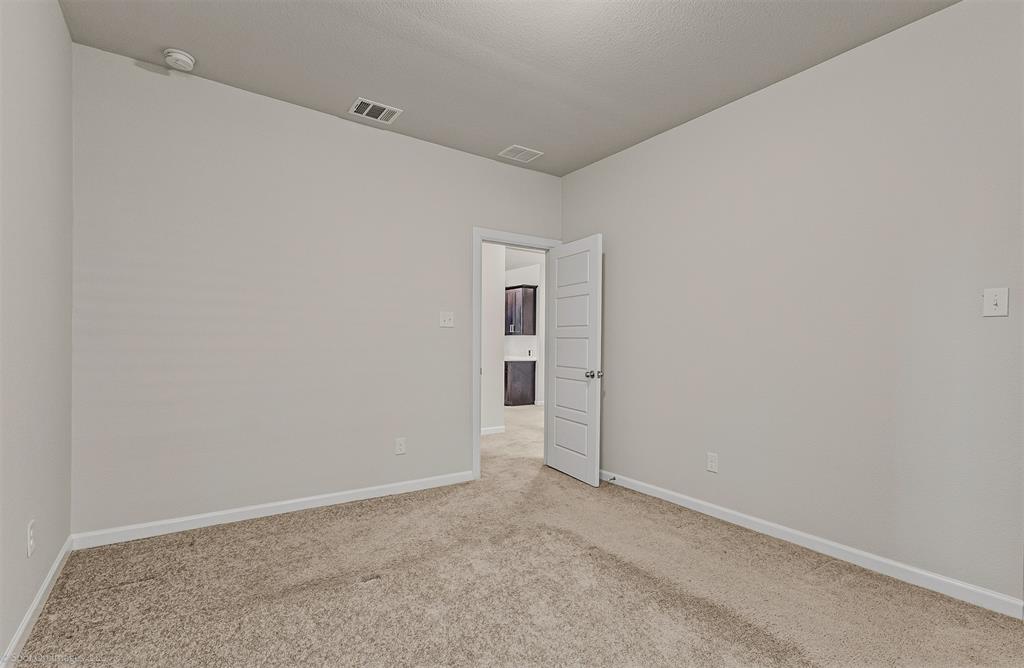 638 Pinehurst Road Red Oak, TX 75154 - Photo 27 of 38 Unfurnished room featuring baseboards and light carpet