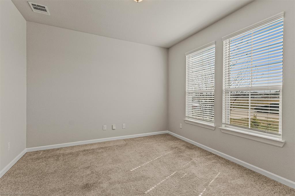 638 Pinehurst Road Red Oak, TX 75154 - Photo 28 of 38 Unfurnished room with baseboards and light colored carpet