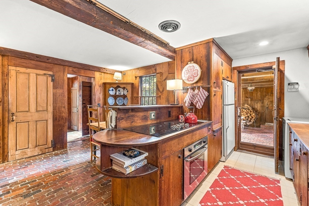 5 Wood Lane Winchester, MA 01890 - Photo 18 of 42 a kitchen with stainless steel appliances granite countertop a stove and a sink