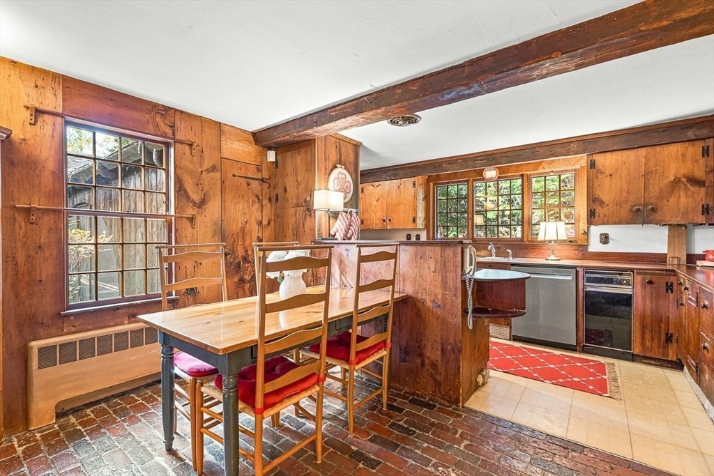 5 Wood Lane Winchester, MA 01890 - Photo 19 of 42 a view of a living room and kitchen with a large window