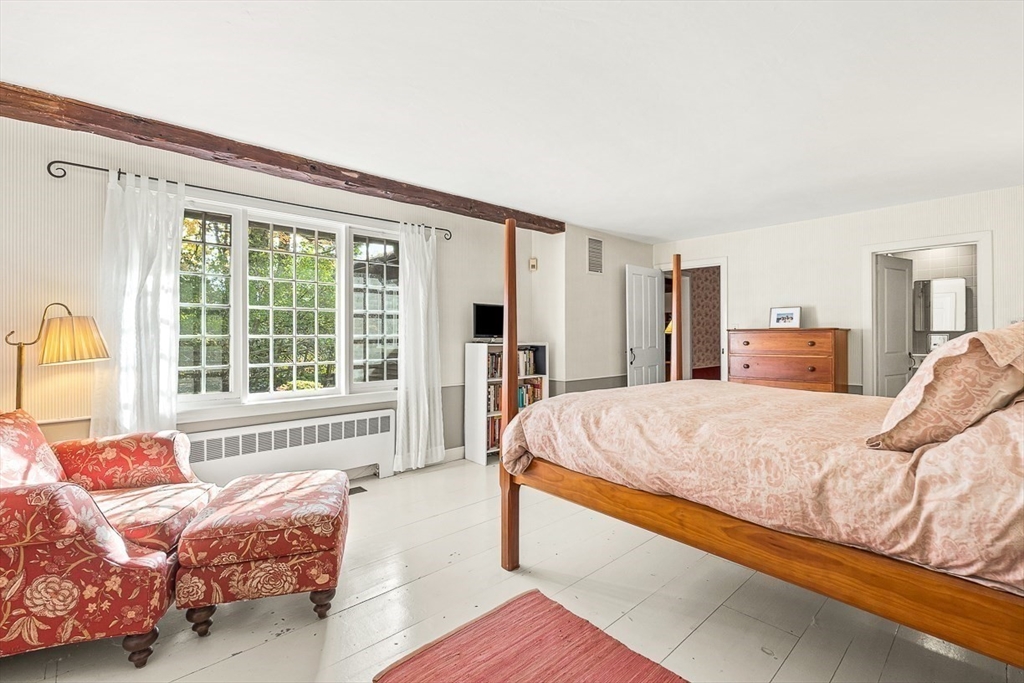 5 Wood Lane Winchester, MA 01890 - Photo 26 of 42 a spacious bedroom with a bed and a large window