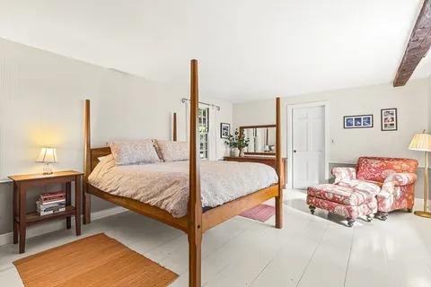 a bedroom with a bed and a cabinets