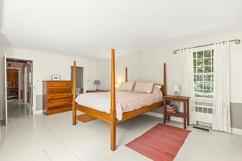 a bathroom with a sink shower and a mirror
