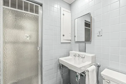 a bedroom with a bed and dresser