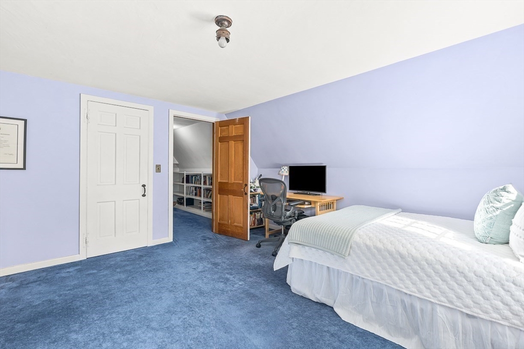 5 Wood Lane Winchester, MA 01890 - Photo 31 of 42 a bedroom with a bed and a television