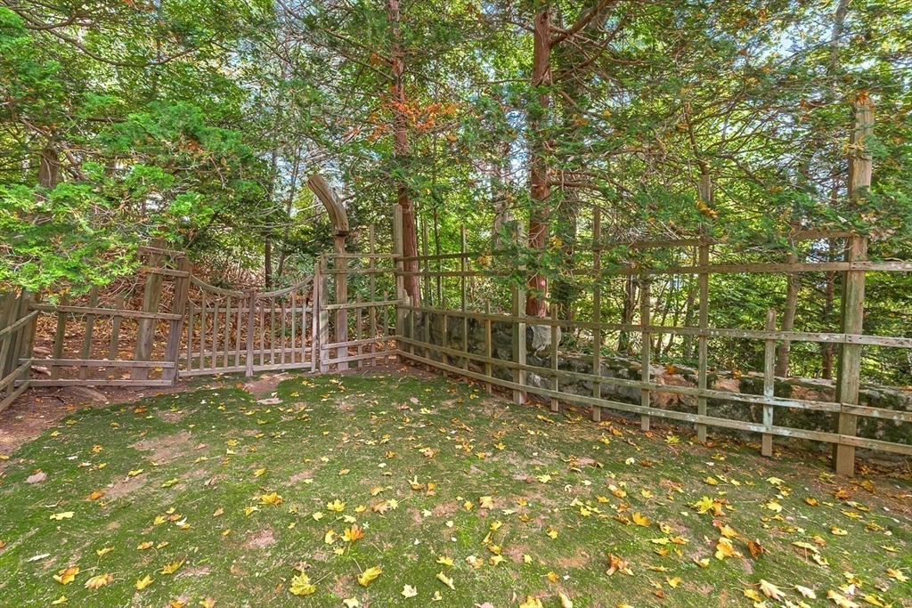 5 Wood Lane Winchester, MA 01890 - Photo 36 of 42 a view of a yard with wooden fence