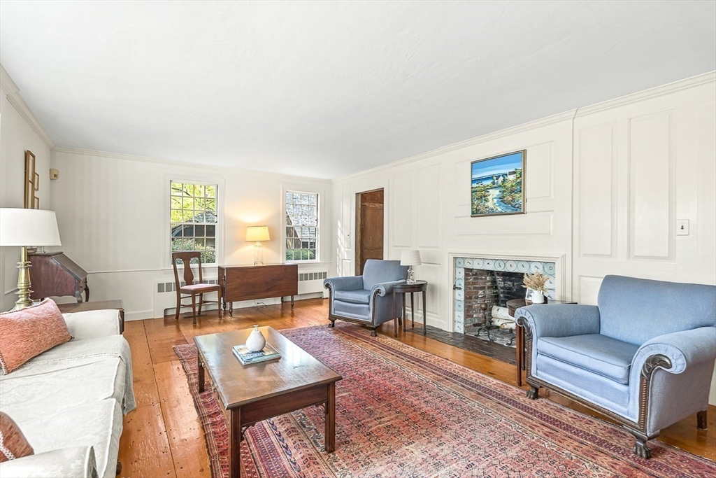 5 Wood Lane Winchester, MA 01890 - Photo 8 of 42 a living room with furniture a fireplace and a table