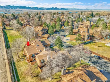 an aerial view of residential houses with outdoor space