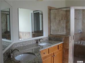 112 Rushing Water Lane Troutman, NC 28166 - Photo 8 of 16 a bathroom with a granite countertop sink and a mirror