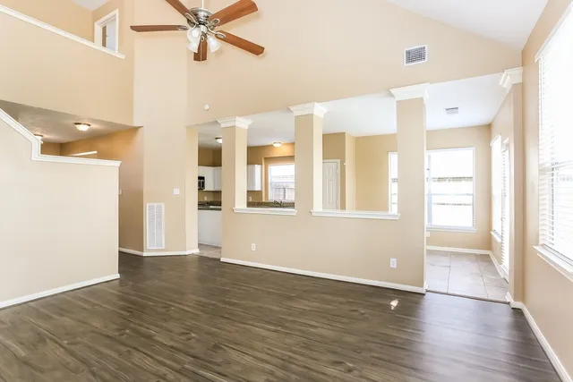a view of an entryway with wooden floor