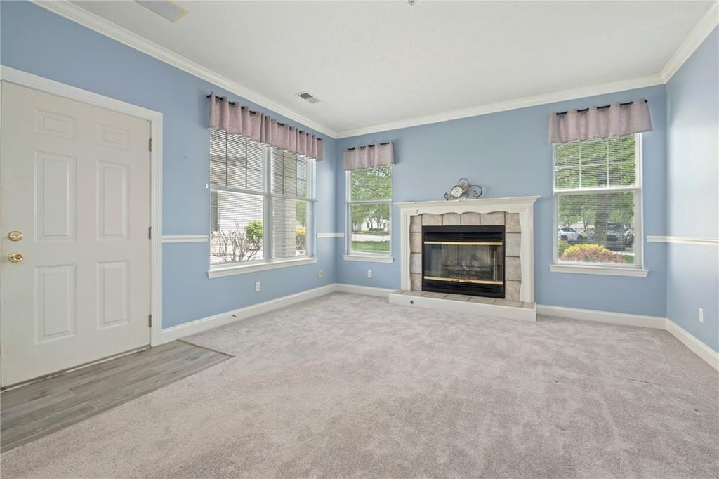 212 Adams Pointe Boulevard, Unit 7 Mars, PA 16046 - Photo 3 of 42 Light And Bright Living Room Features A Gas Fireplace Too