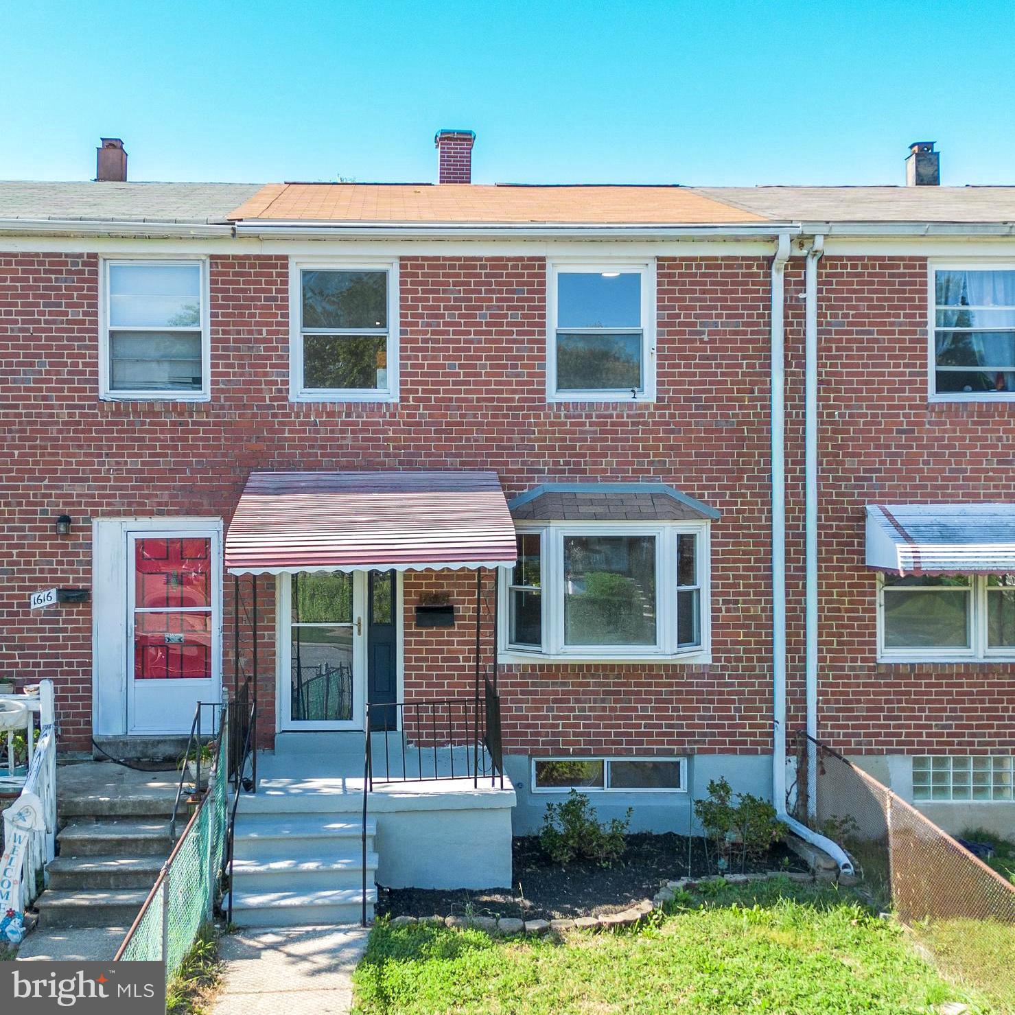 1618 Riverwood Road Baltimore, MD 21221 - Photo 1 of 26 a front view of a house with garden