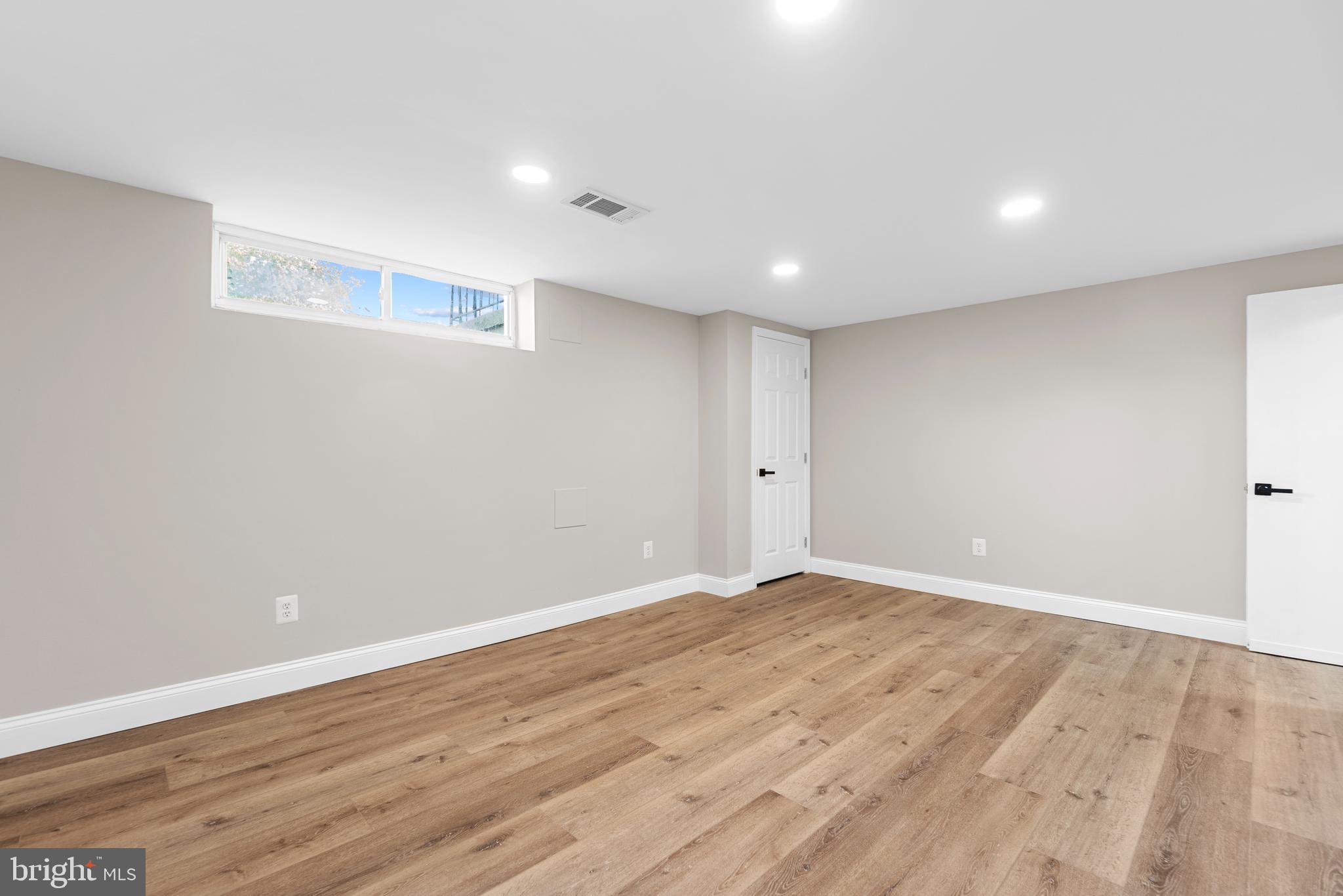 1618 Riverwood Road Baltimore, MD 21221 - Photo 18 of 26 a view of an empty room with wooden floor