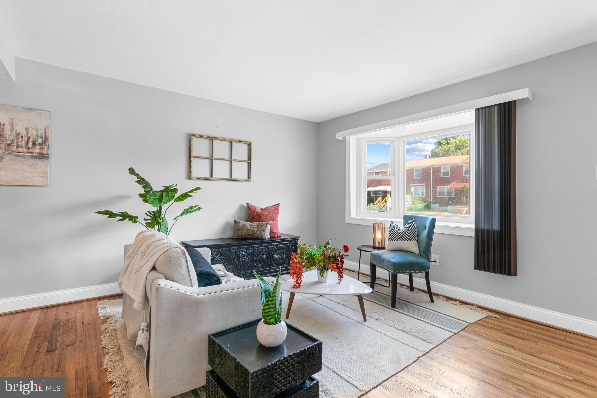 1618 Riverwood Road Baltimore, MD 21221 - Photo 3 of 26 a living room with furniture and a potted plant