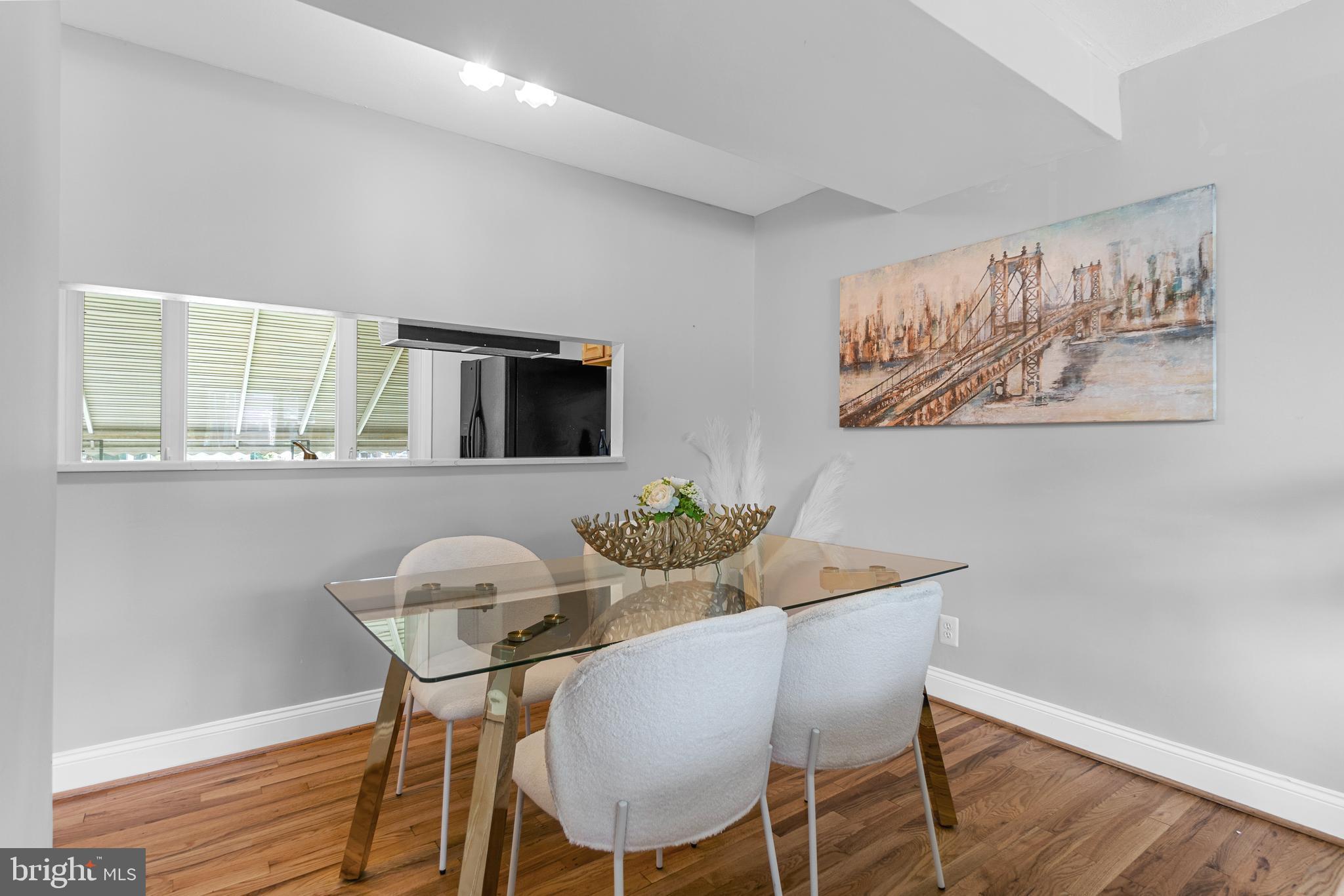 1618 Riverwood Road Baltimore, MD 21221 - Photo 5 of 26 a view of a dining room with furniture and wooden floor