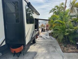 55 Boca Chica Road, Unit 47 Key West, FL 33040 - Photo 13 of 18 a backyard of a house with table and chairs