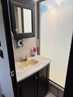 55 Boca Chica Road, Unit 47 Key West, FL 33040 - Photo 14 of 19 a bathroom with a sink and a mirror