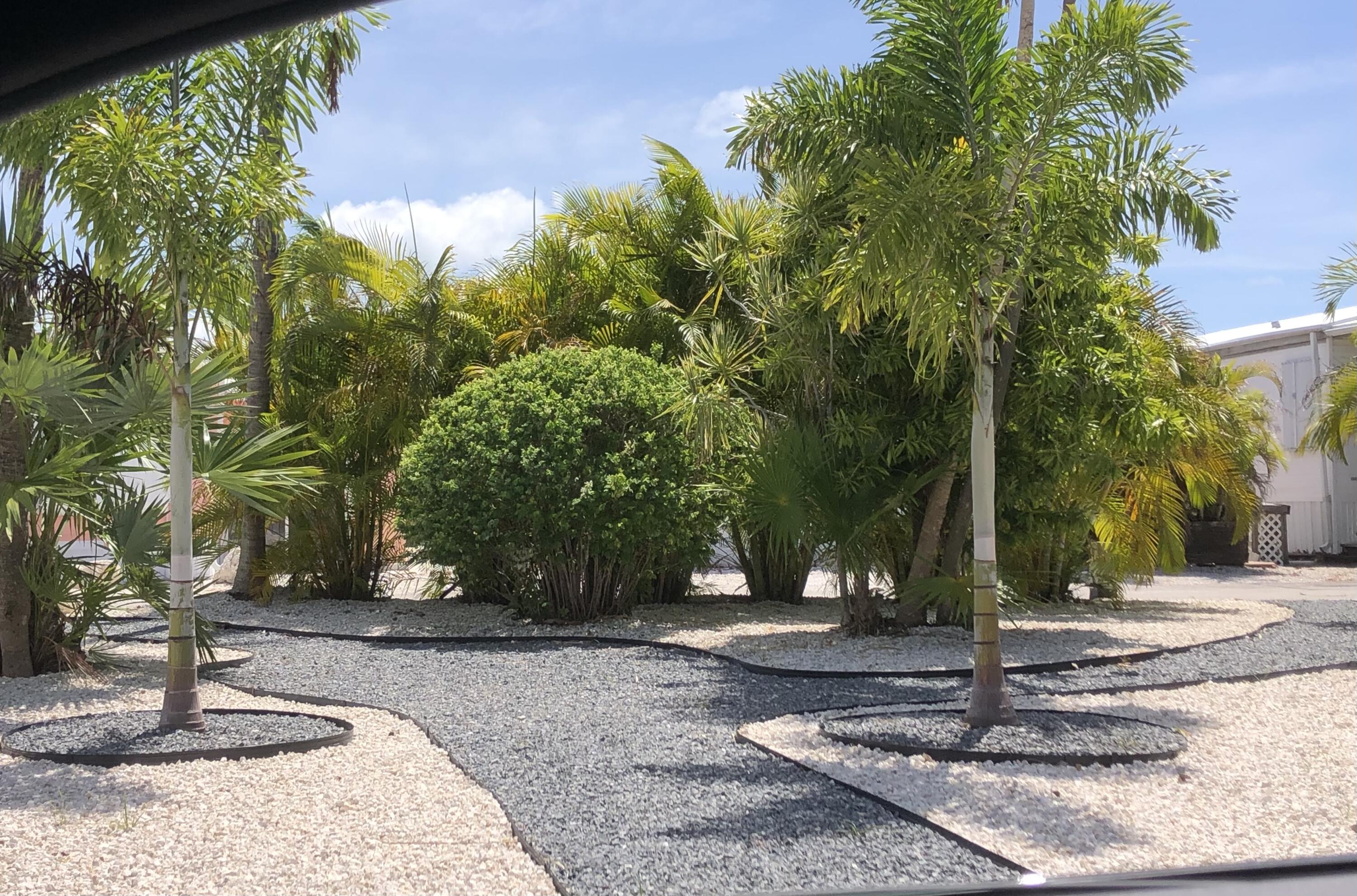 55 Boca Chica Road, Unit 47 Key West, FL 33040 - Photo 18 of 18 a view of a tree in front of a house