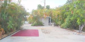 55 Boca Chica Road, Unit 47 Key West, FL 33040 - Photo 2 of 18 a view of backyard with outdoor space and trees