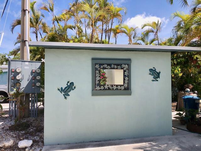 55 Boca Chica Road, Unit 47 Key West, FL 33040 - Photo 6 of 18 a view of a door and a potted plant
