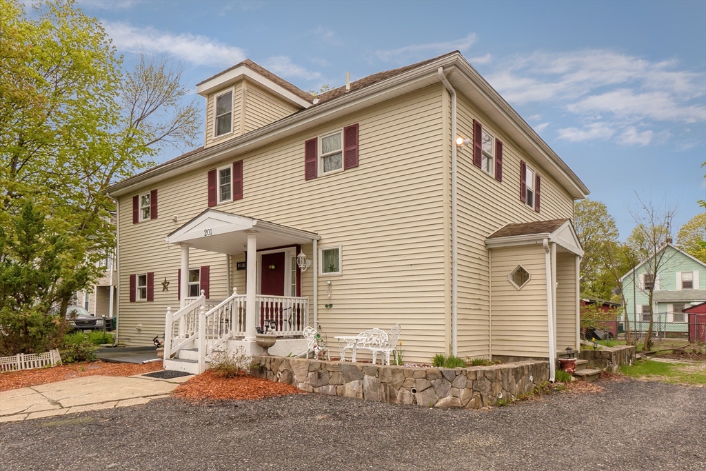 201-203 Stone Street Clinton, MA 01510 - Photo 2 of 42 a view of a house with a patio