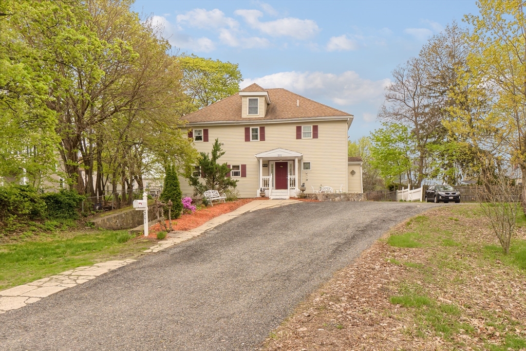201-203 Stone Street Clinton, MA 01510 - Photo 41 of 42 a front view of a house with a yard and garage