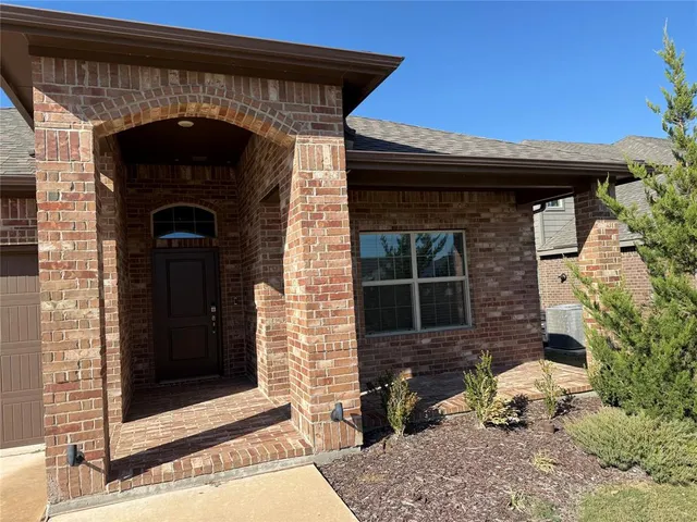 a front view of a house with parking