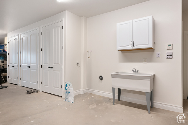 230 Boulder Way Leeds, UT 84746 - Photo 41 of 72 Garage featuring a washtub, indoor nozzle & cabinetry for water heaters & A/C.