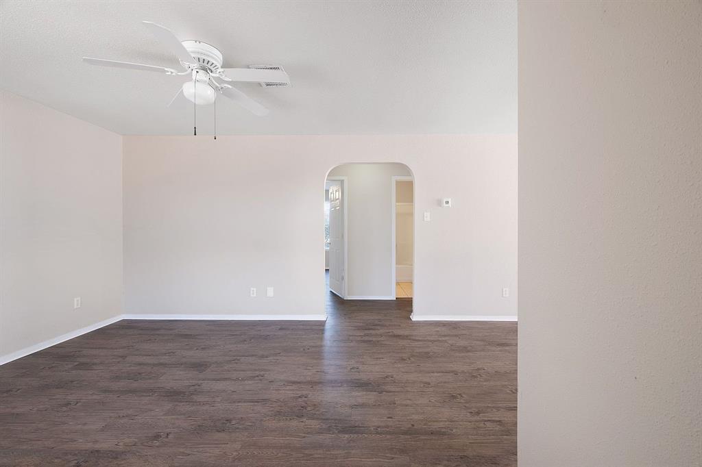 2214 Katy Lane, Unit A Georgetown, TX 78626 - Photo 2 of 15 a view of an empty room with a fan