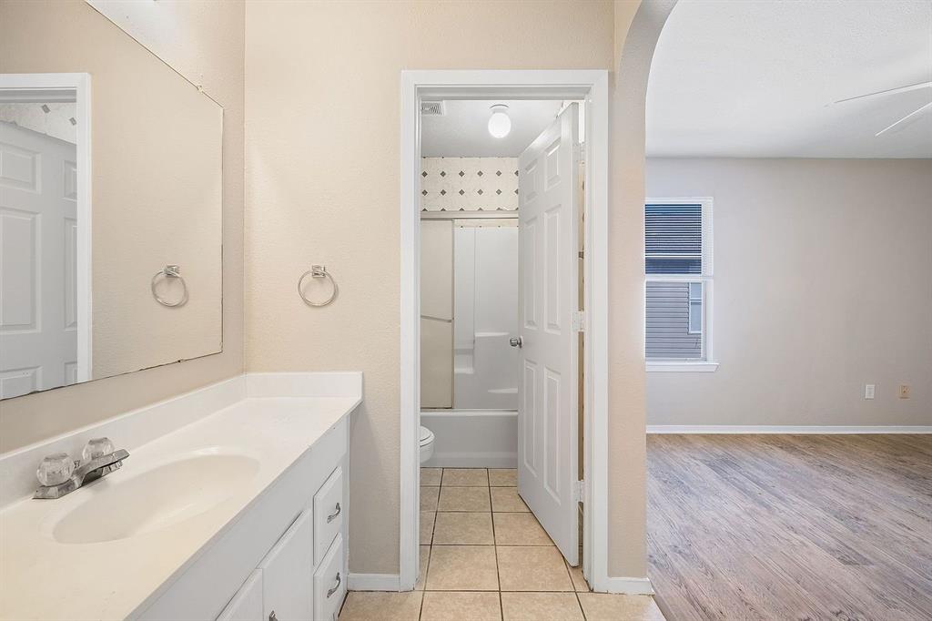 2214 Katy Lane, Unit A Georgetown, TX 78626 - Photo 10 of 15 a bathroom with a sink a toilet and shower