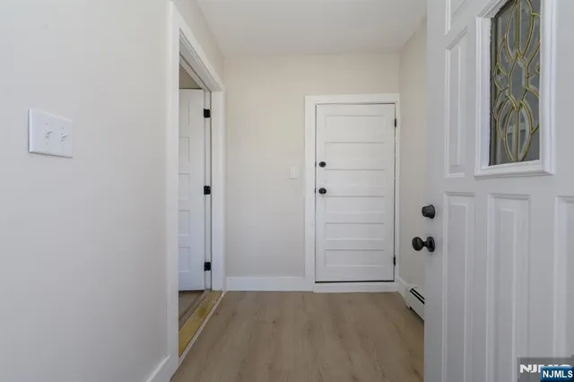 a view of an empty room with closet