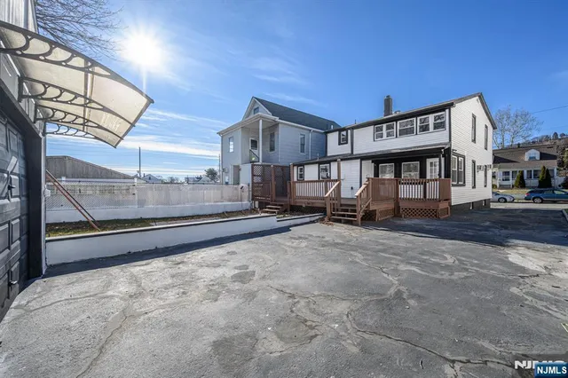a view of a backyard with sitting area