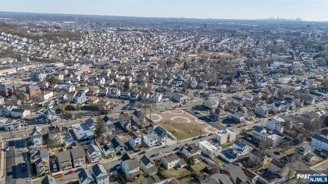 an aerial view of residential house and green space