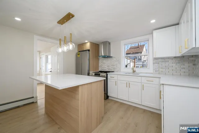 a kitchen with cabinets and outdoor space