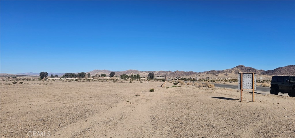 0 Condor Road Twentynine Palms, CA 92277 - Photo 3 of 13 a view of a covered with tall trees