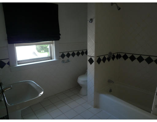 53 Rockland Street Springfield, MA 01118 - Photo 15 of 17 a bathroom with a toilet and a shower