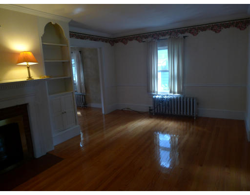 53 Rockland Street Springfield, MA 01118 - Photo 2 of 17 a view of empty room with wooden floor and fan