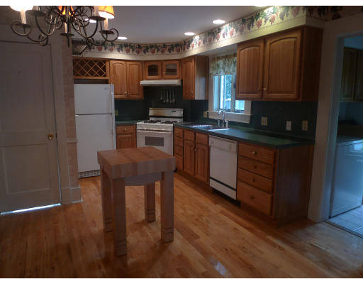 53 Rockland Street Springfield, MA 01118 - Photo 6 of 17 a kitchen with stainless steel appliances granite countertop a refrigerator a stove and a microwave
