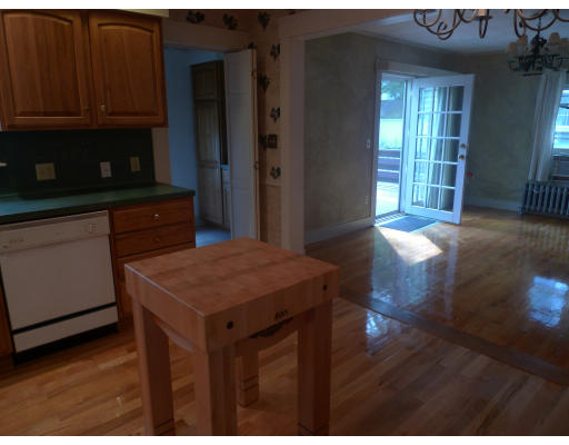 53 Rockland Street Springfield, MA 01118 - Photo 10 of 17 a kitchen with a wooden floor and a kitchen island