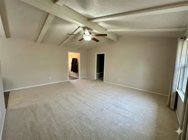 a view of empty room with windows