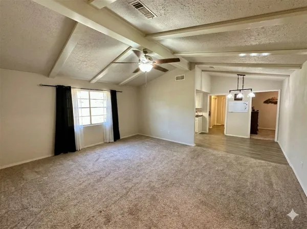 a view of a hallway with windows